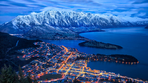 City Night Mountain View Lagoon City Lights Snow Mountains Cityscape Water 4795x3400 Wallpaper