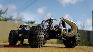 Toys RC Car Remote Control Blurred Tire Gasoline Rovan 1 5 Wheels Buggy Pipe Blurry Background 4240x2384 wallpaper