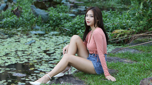 Asian Model Women Long Hair Dark Hair Sitting Jean Shorts Grass Depth Of Field Pond White Shoes Long 2560x1706 Wallpaper