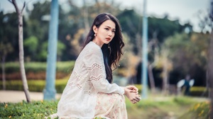 Asian Model Women Sitting White Dress Grass Flowers Trees Poles Earring Long Hair Brunette 3840x2561 Wallpaper